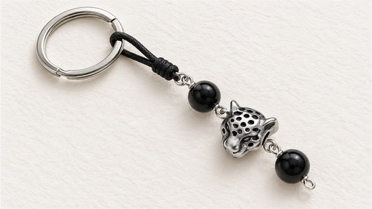 Porte-clés motif léopard et cordon perlé : apprêt acier inoxydable léopard et onyx