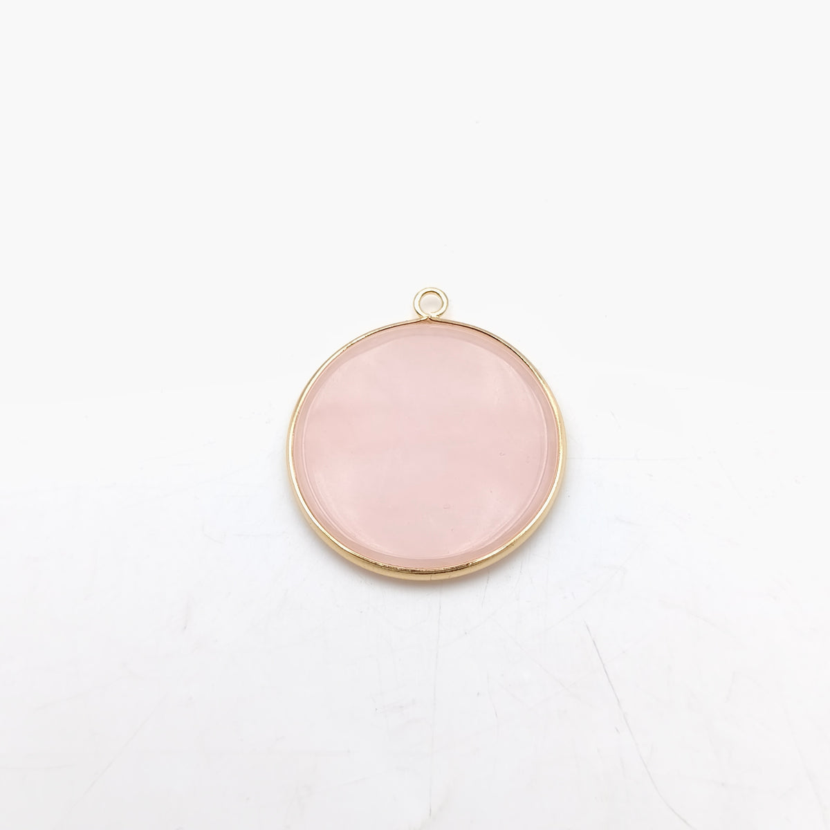 Pendentif rond serti Quartz rose