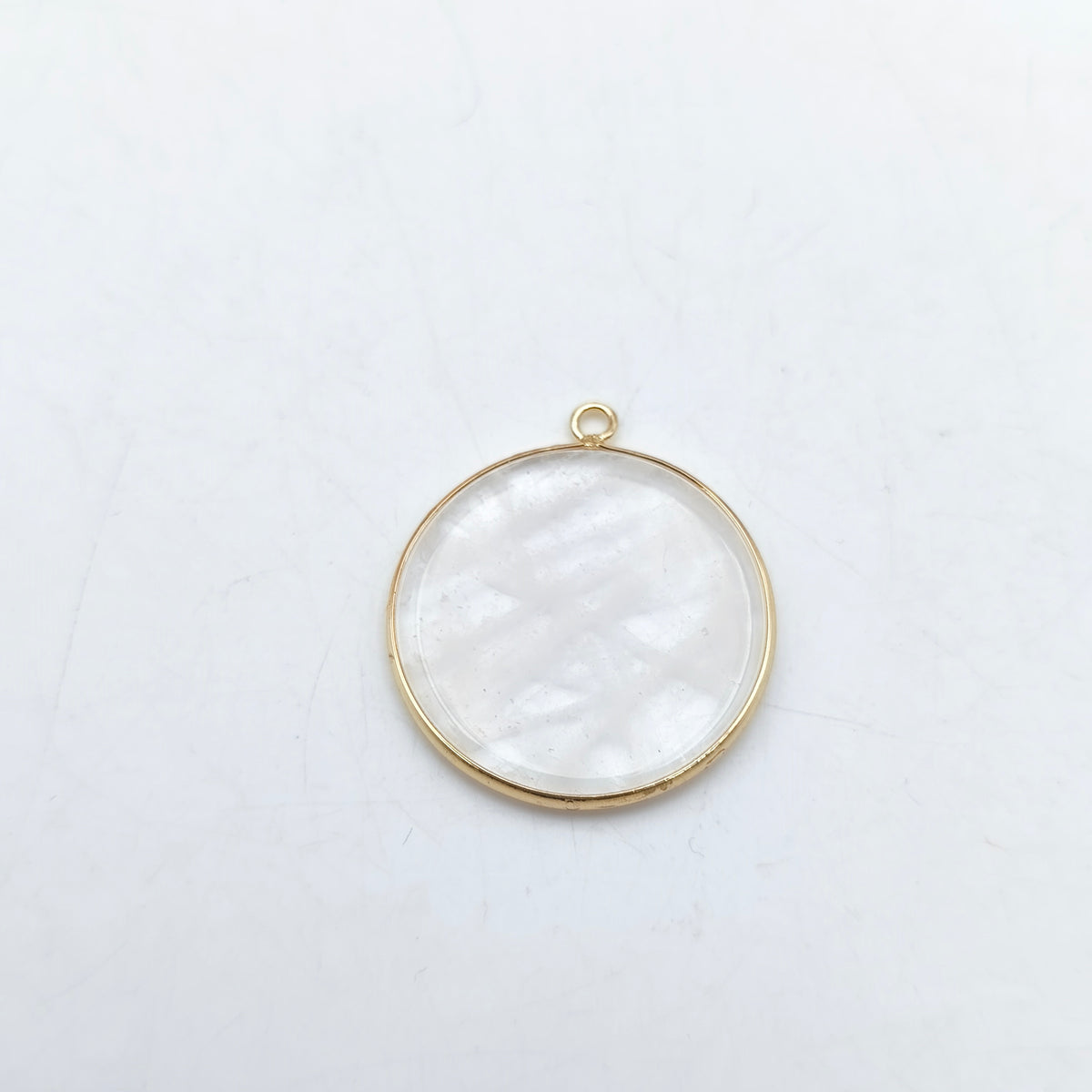 Pendentif rond serti Cristal de roche
